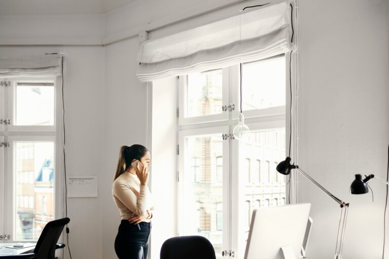 Businesswoman talking on phone in office