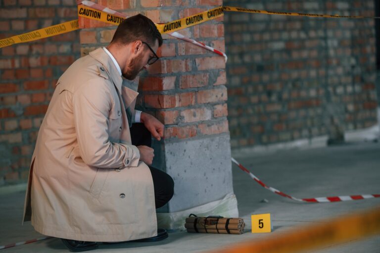 Detective in coat is on the crime scene with explosive bomb