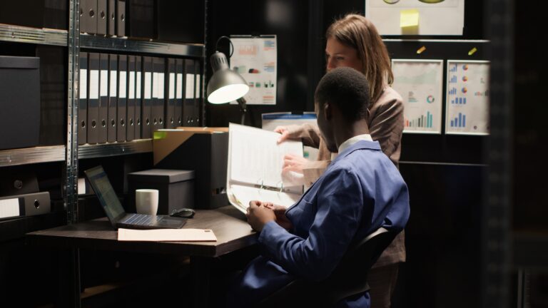 Detectives analyzing evidence